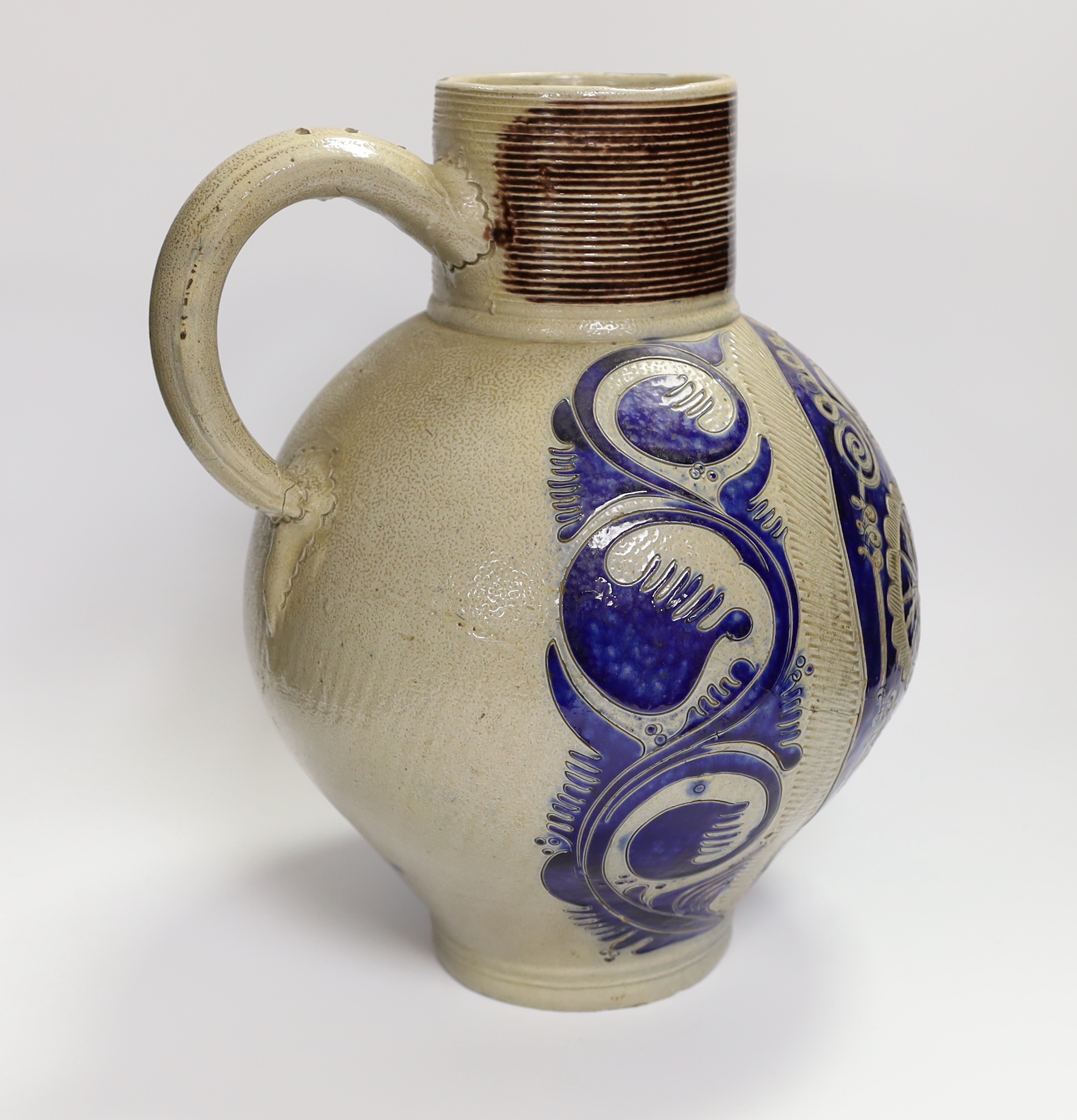 An 18th century German Westerwald stoneware jug with GR cypher, 32cm high